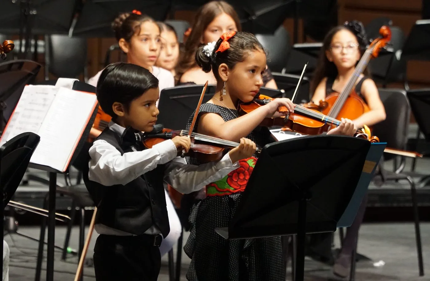 Young Harmony Project violinists performing together